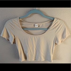 Nude crop top shirt.